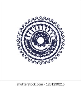 Blue donut icon inside distressed rubber stamp with grunge texture