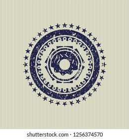 Blue donut icon inside rubber grunge texture seal