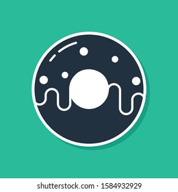 Blue Donut with sweet glaze icon isolated on green background.  Vector Illustration