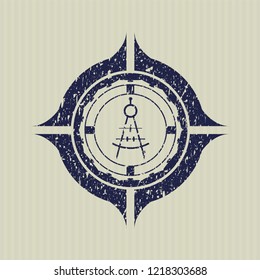 Blue drawing compass icon inside distressed rubber grunge texture seal