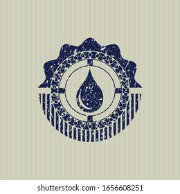 Blue drop icon inside distress rubber grunge stamp