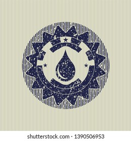 Blue drop icon inside distressed grunge stamp