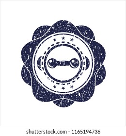Blue dumbbell icon inside distressed rubber grunge stamp