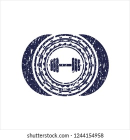 Blue dumbbell icon inside distressed grunge style stamp
