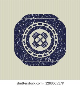 Blue dumbbell icon inside distressed with rubber seal texture