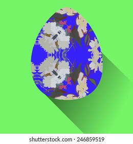 Blue Easter egg with floral ornaments  on a  green  background. Hand drawn. 