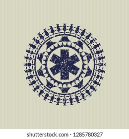 Blue emergency cross icon inside rubber texture