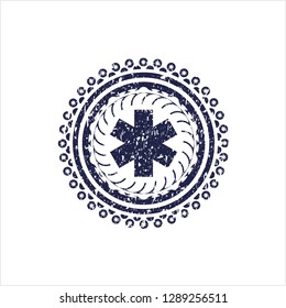 Blue emergency cross icon inside distressed grunge style stamp
