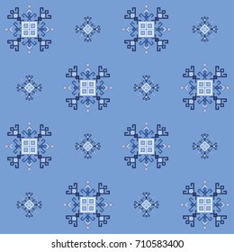 Blue ethnic design with traditional tribal motifs of crooked lines, triangles, squares, circles. Mayan ethnic symbol in winter colors, geometric pattern decor. Embroidery style winter clothes pattern.