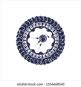 Blue fertilization icon inside rubber stamp with grunge texture