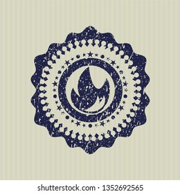 Blue fire icon inside distress grunge seal