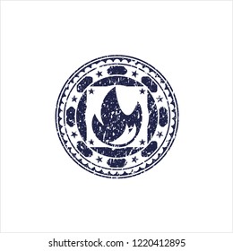 Blue fire icon inside rubber stamp