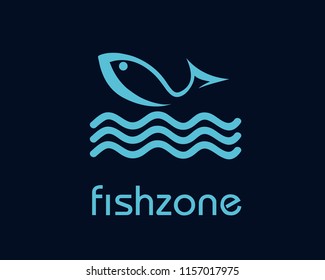 Blue fish jumping in the water.Vector logo isolated on dark background.Modern, flat icon representing a marine animal.