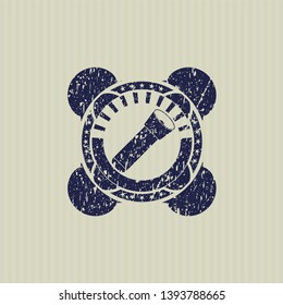 Blue flashlight icon inside distress grunge stamp