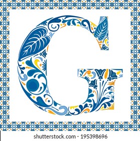 Blue floral capital letter G in frame made of Portuguese tiles