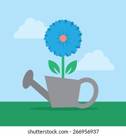 Blue flower in watering can
