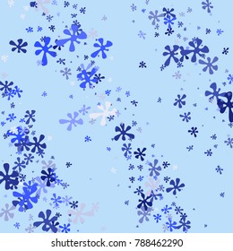 Blue flowers on a blue background. Abstraction with flowers. Blue confetti. Blue flowers. Spring. A scattering of confetti. Placer from the flowers.