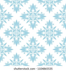 Blue flowers on white background. Ornamental seamless pattern for textile and wallpapers