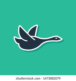 Blue Flying duck icon isolated on green background.  Vector Illustration