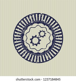 Blue gear, team work icon inside distressed rubber grunge stamp
