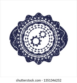 Blue gear, team work icon inside distressed rubber texture