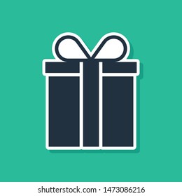 Blue Gift box icon isolated on green background.  Vector Illustration