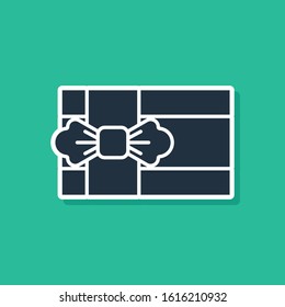 Blue Gift box icon isolated on green background.  Vector Illustration