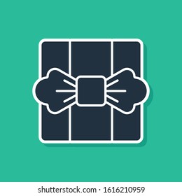 Blue Gift box icon isolated on green background.  Vector Illustration