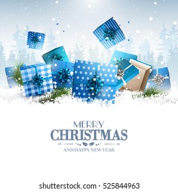 Blue gift boxes in the snow - Christmas greeting card
