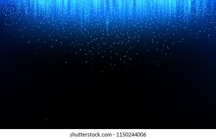 Blue glitter abstract background of neon ray light of falling blue glittery particles