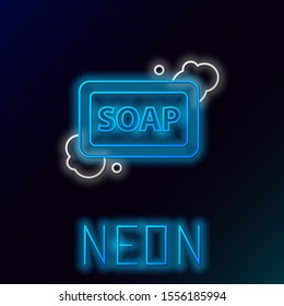 Blue glowing neon line Bar of soap with foam icon isolated on black background. Soap bar with bubbles. Colorful outline concept. Vector Illustration