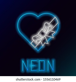 Blue glowing neon line Candy in heart shaped box and bow icon isolated on black background. Valentines Day. Colorful outline concept. Vector Illustration