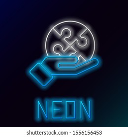 Blue glowing neon line Piece of puzzle in hand icon isolated on black background. Business, marketing, finance, template, layout, infographics concept. Colorful outline concept. Vector Illustration