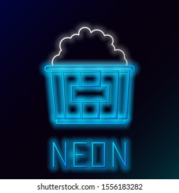 Blue glowing neon line Popcorn in cardboard box icon isolated on black background. Popcorn bucket box. Colorful outline concept. Vector Illustration