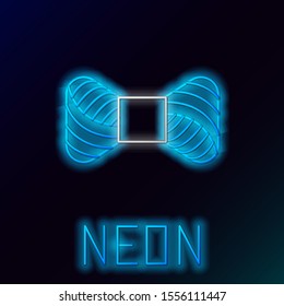 Blue glowing neon line Sewing thread on spool icon isolated on black background. Yarn spool. Thread bobbin. Colorful outline concept. Vector Illustration