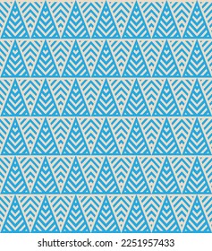 Blue graphic Christmas tree pattern. Blue triangle pattern backdrop.