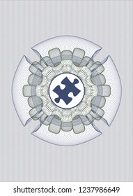 Blue and green abstract rosette with jigsaw puzzle piece icon inside