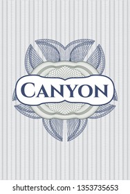 Blue and green abstract rosette with text Canyon inside