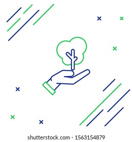 Blue and green line Tree in hand of environmental protection icon isolated on white background. Seed and seedling. Planting sapling. Ecology concept. Colorful outline concept. Vector Illustration