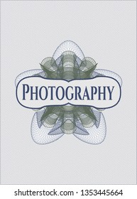 Blue and green money style rosette with text Photography inside