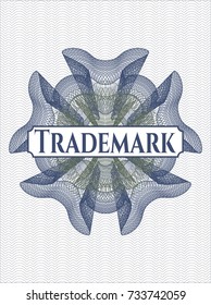 Blue and green money style rosette with text Trademark inside