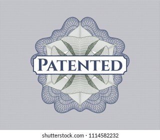 Blue and green passport money rossete with text Patented inside