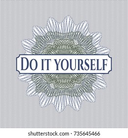 Blue and green passport money rossete with text Do it yourself inside