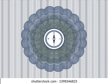 Blue and green passport rosette with compass icon inside