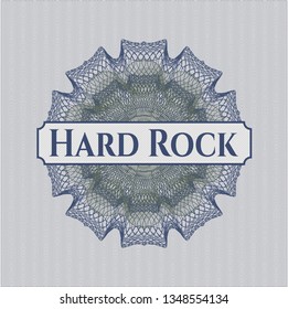 Blue and green passport rosette with text Hard Rock inside