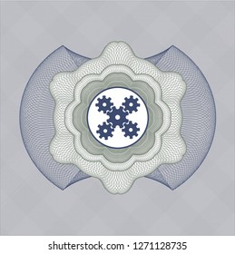 Blue and green passport style rosette with mechanism icon inside
