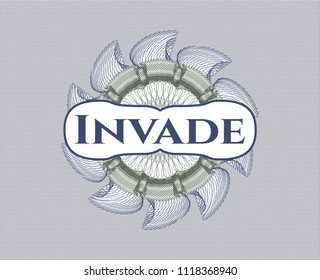 Blue and green rosette (money style emblem) with text Invade inside