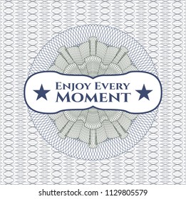 Blue and green rosette or money style emblem with text Enjoy Every Moment inside