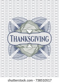 Blue and green rosette or money style emblem with text Thanksgiving inside