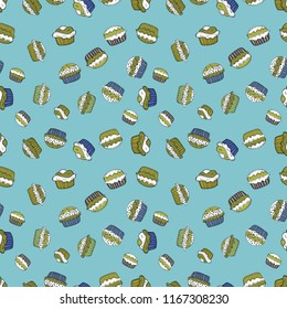 Blue, green and white color. Vector illustration. Seamless pattern hand drawn cupcakes. Print for bakery. Sweets background design.
